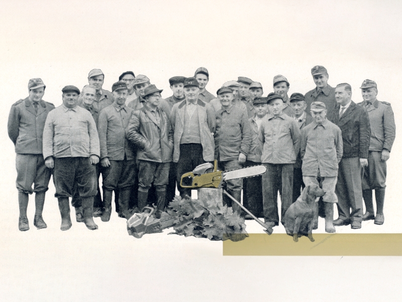 Photo of a group of people with a saw and a dog; black and white image with partial gold colorizing.