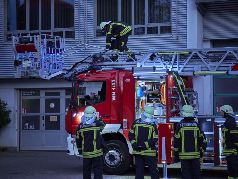 Firefighters practice with the turntable ladder.
